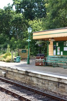 The end of the station platform and at Harmans Cross Station, part of the Swanage Steam railway network in Dorset. A period setting evoking a nostalgic scene.
