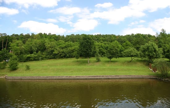 Water dam line with trees and blue sky