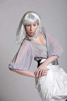 Beautiful fashionable girl with silver wig