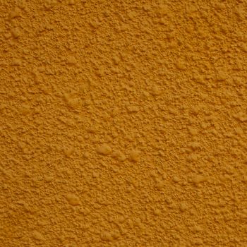 a square of yellow painted stucco