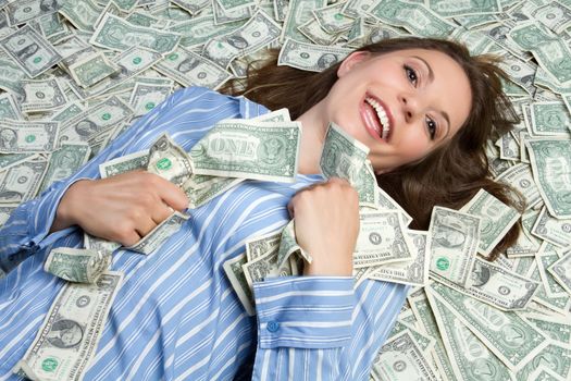 Beautiful woman laying in money