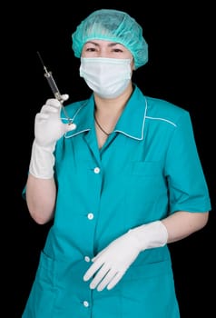 Portrait of nurse with syringe in gloved hand