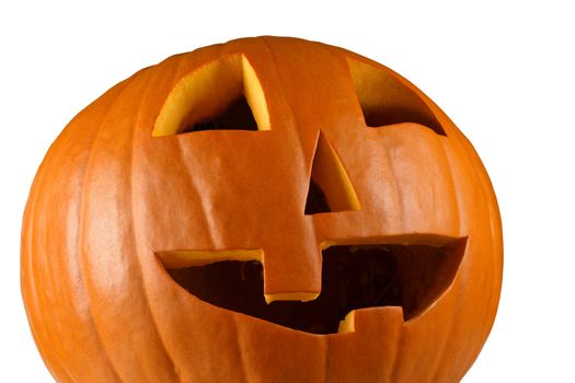 Closeup image of a carved happy pumpkin on a white background.
