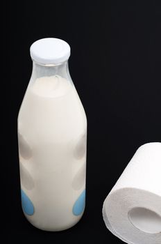 Conceptual photo with milk and wc paper