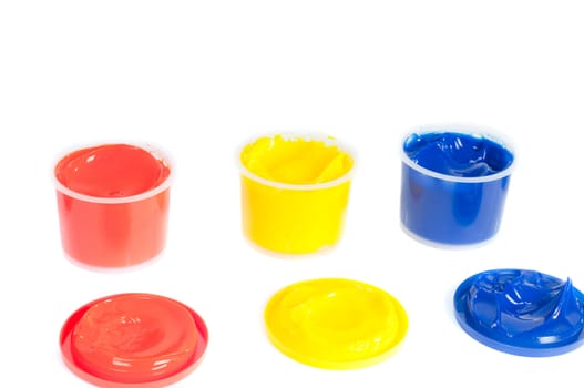 Shot of multicolored cans of paint isolated on white