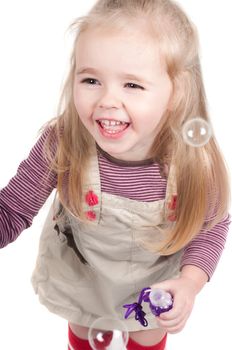 Shot of little girl, who making bubbles