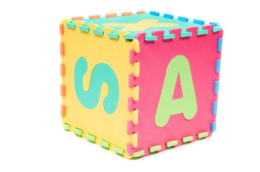 Studio shot of big cube with letters isolated on white