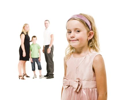 Young girl in front of her family isolated on white background