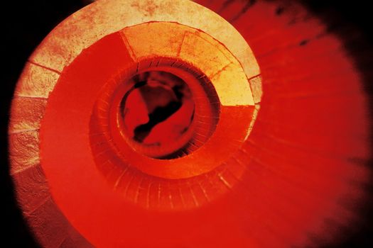 Photo manipulation of a red staircase in a library.