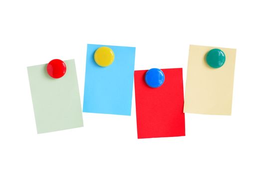 Few colored paper sheets hanging with magnets on white background. Clipping path included