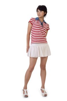 Asian young girl standing and looking copyspace, full length portrait isolated on white background.