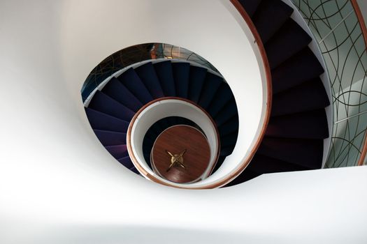 a view down a spiral staircase with room for copyspace