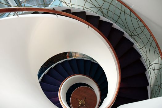 a view down a spiral staircase with copyspace