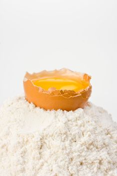 open egg on a bed of flour