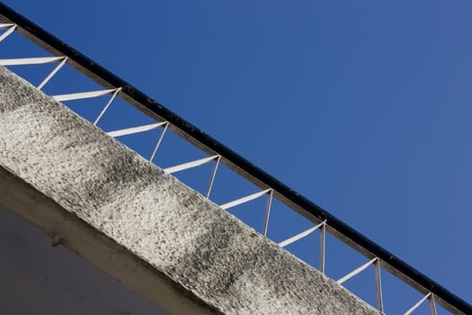 The balcony of a old roof under the blue sky