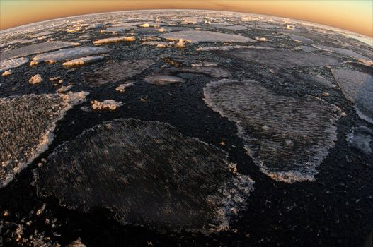 In the spring the broken ice floes have created a freakish pattern. Ladoga lake. Russia.