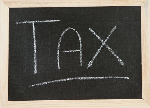 Black chalk board with wooden framed surround with the word Tax.