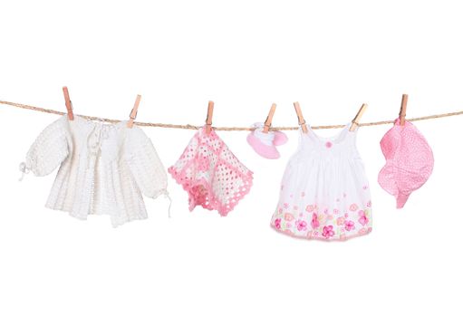 Baby Girl Clothing Hanging on a Clothesline Isolated on White Background