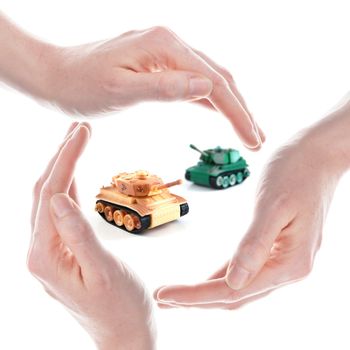 peace concept with toy tank and hand isolated on white background