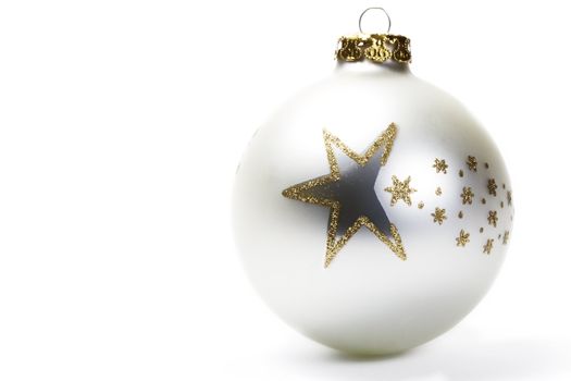 dull white christmas ball with golden stars on white background