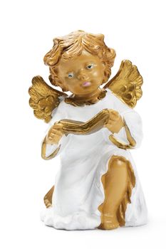 white and golden christmas angel figurine reading book on white background