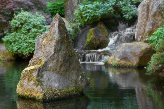 Spiked Boulder in the middle of a  Waterfall pond