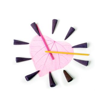 clock by aroma sticks isolated over white