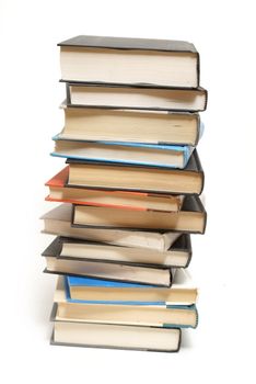 A stacked tower of intellectual books isolated on white.