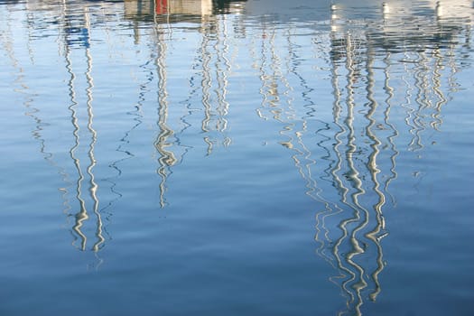 Sails reflected on the sea