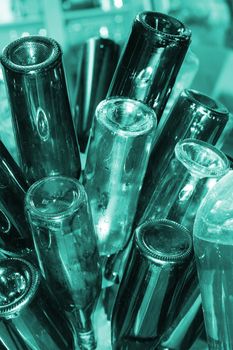 Abstract image of washed wine bottles drying on rack before filling with home made wine.