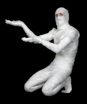 Man in bandage show inside on the black background