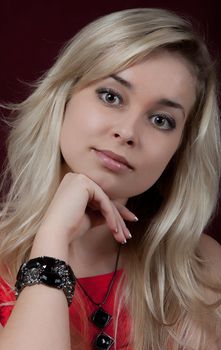 Portrait of the young beautiful girl on a dark background