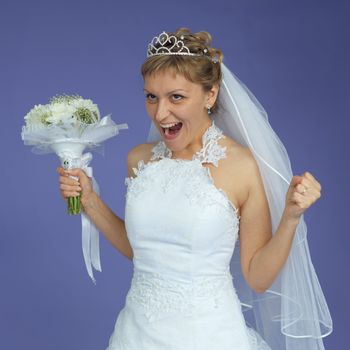 The beautiful bride in a white dress shouts with happiness