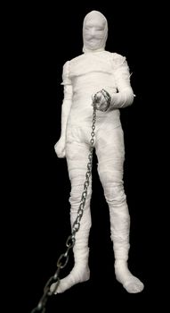 Man in costume mummy with chain to hold on a lead