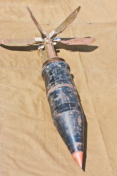 Defused mortar shell lying on the tarpaulin