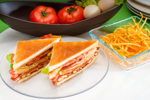 fresh and delicious classic club sandwich over a transparent glass dish