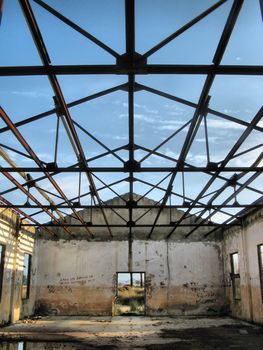 metallic roof structure of an abandoned ruined house