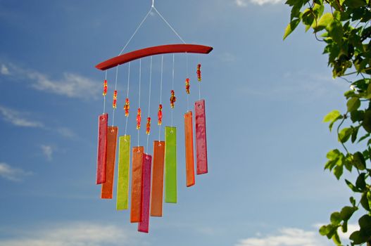 A wind chimes made of glass, pearls and vivid colours
