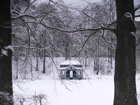 small baroque era boathouse at a little lake, germany, winter