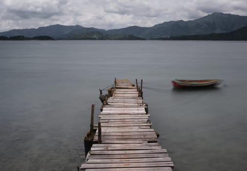look on pier and boat, low saturation
