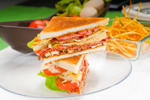 fresh and delicious classic club sandwich over a transparent glass dish