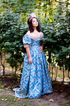 A portrait of lady in a blue baroque dress
