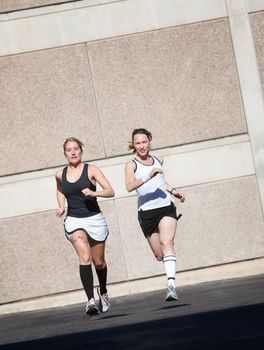 Two pretty women practice for a race.