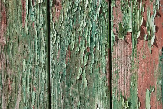 Part of a old woodboard texture painted on red.