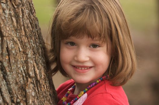 Adorable Young Girl Having Fun at the Park.