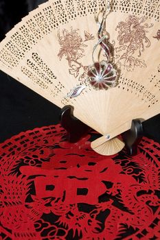 jewelry hitch on bamboo fan and paper-cut