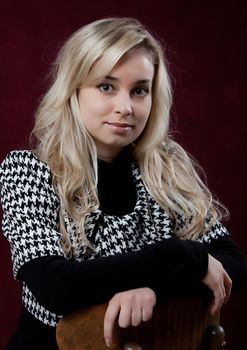 Portrait of the young beautiful girl on a dark background