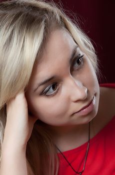 Portrait of the young beautiful girl on a dark background