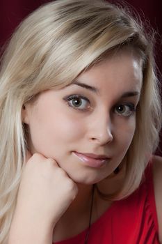 Portrait of the young beautiful girl on a dark background