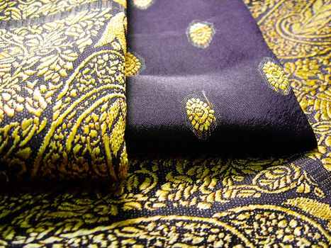 Black and yellow saree folded with floral designs